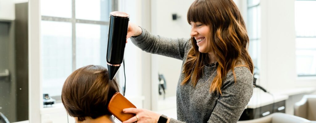 woman holding hair dryer